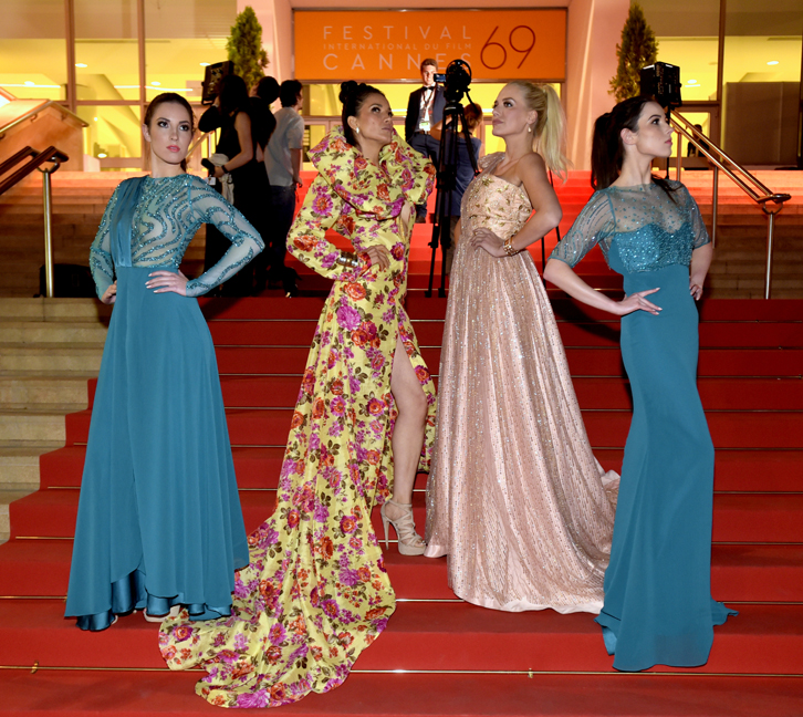 Models wearing gowns by designer Andres Aquino strike a pose on the legendary Cannes Film Festival Red Carpet after the Global Short Film Awards Gala in May 2016.
